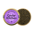 A closed tin of Caviar Kitchen Huso Dauricus caviar beside an open tin of its roe.