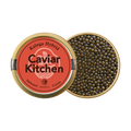 A closed tin of Caviar Kitchen Kaluga Hybrid caviar beside an open tin of its roe.